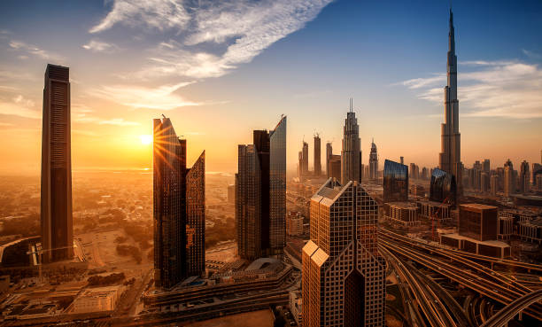 Sunset view of Dubai skyscrapers, highlighting modern architecture and real estate opportunities.